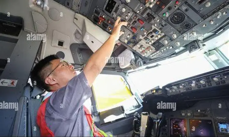 Pilot melakukan pengecekan di kokpit pesawat